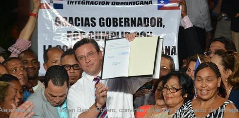 Gov. García Padilla celebrates with Dominican community new law he enacted that allows undocumented immigrants the right to test for driving licenses.